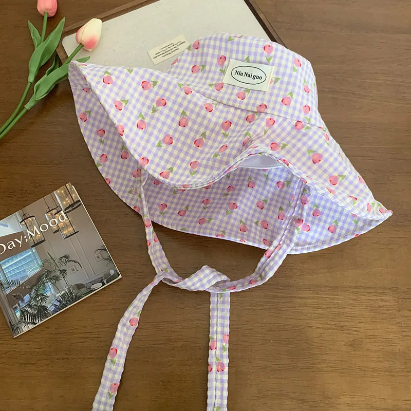 Version coréenne des chapeaux de seau à carreaux à imprimé fraîche fraîche pour les femmes voyage d'été