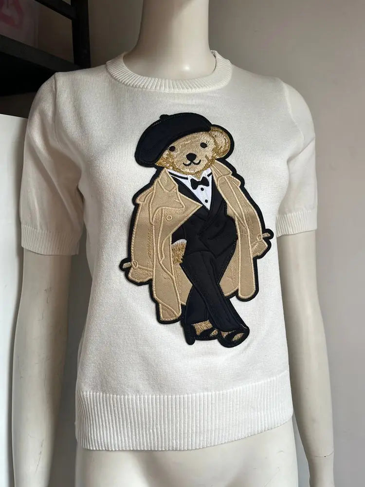 Eurooppalainen tyylinen luksusbrändi löysä O-kaula-aukkoa Pullover Tops Neule Woman Lyhythihainen T-paita Ladies Wooleulottu villapaita