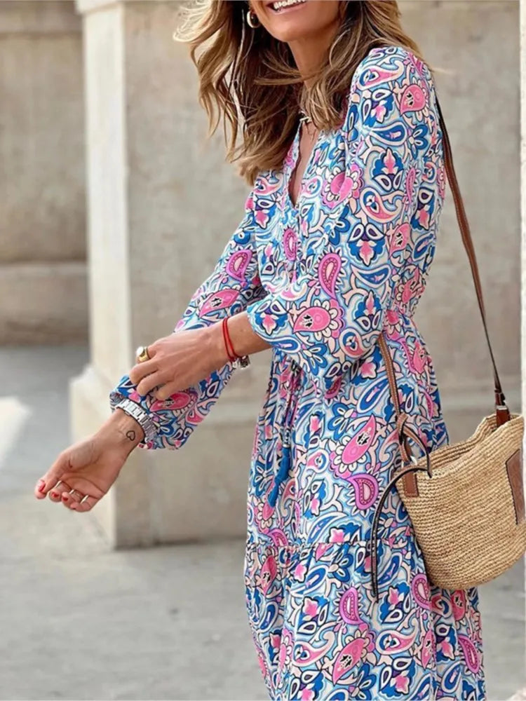 Frauen Herbst neue modische gedruckte sexy V-Ausschnitt Langhülse hohe Taille elastische Taille mittlere Länge Bohemian Kleid